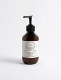 YUTASHA Kinuhada Hand Cream in a brown glass pump bottle with a minimalist white label on a clean white background.