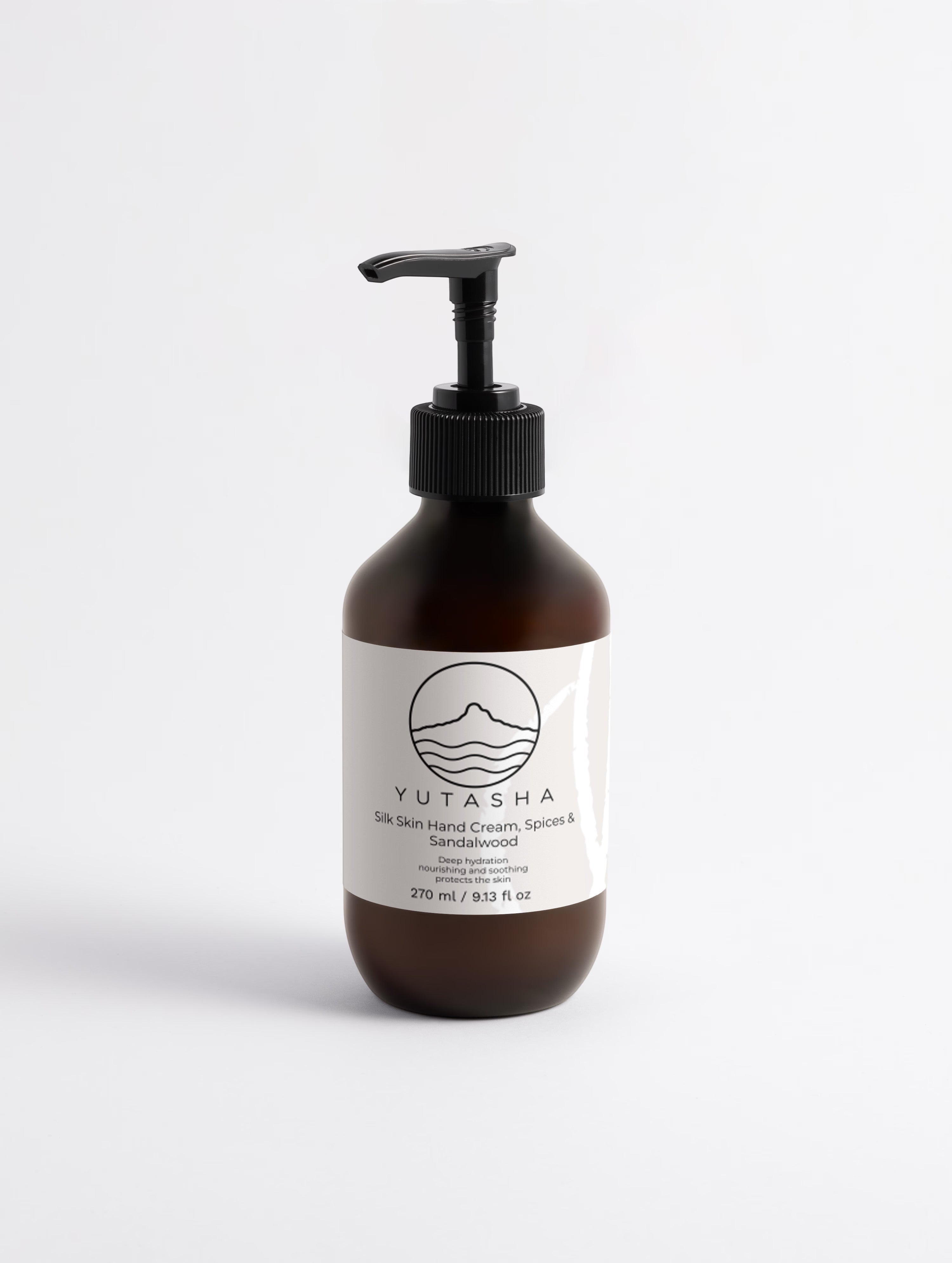 YUTASHA Kinuhada Hand Cream in a brown glass pump bottle with a minimalist white label on a clean white background.