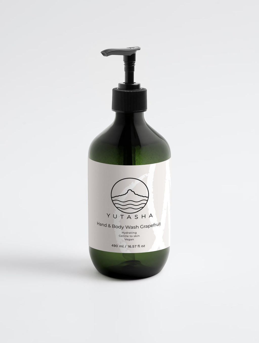YUTASHA Natsu grapefruit hydrating body wash in a dark green bottle with a black pump dispenser on a white background.
