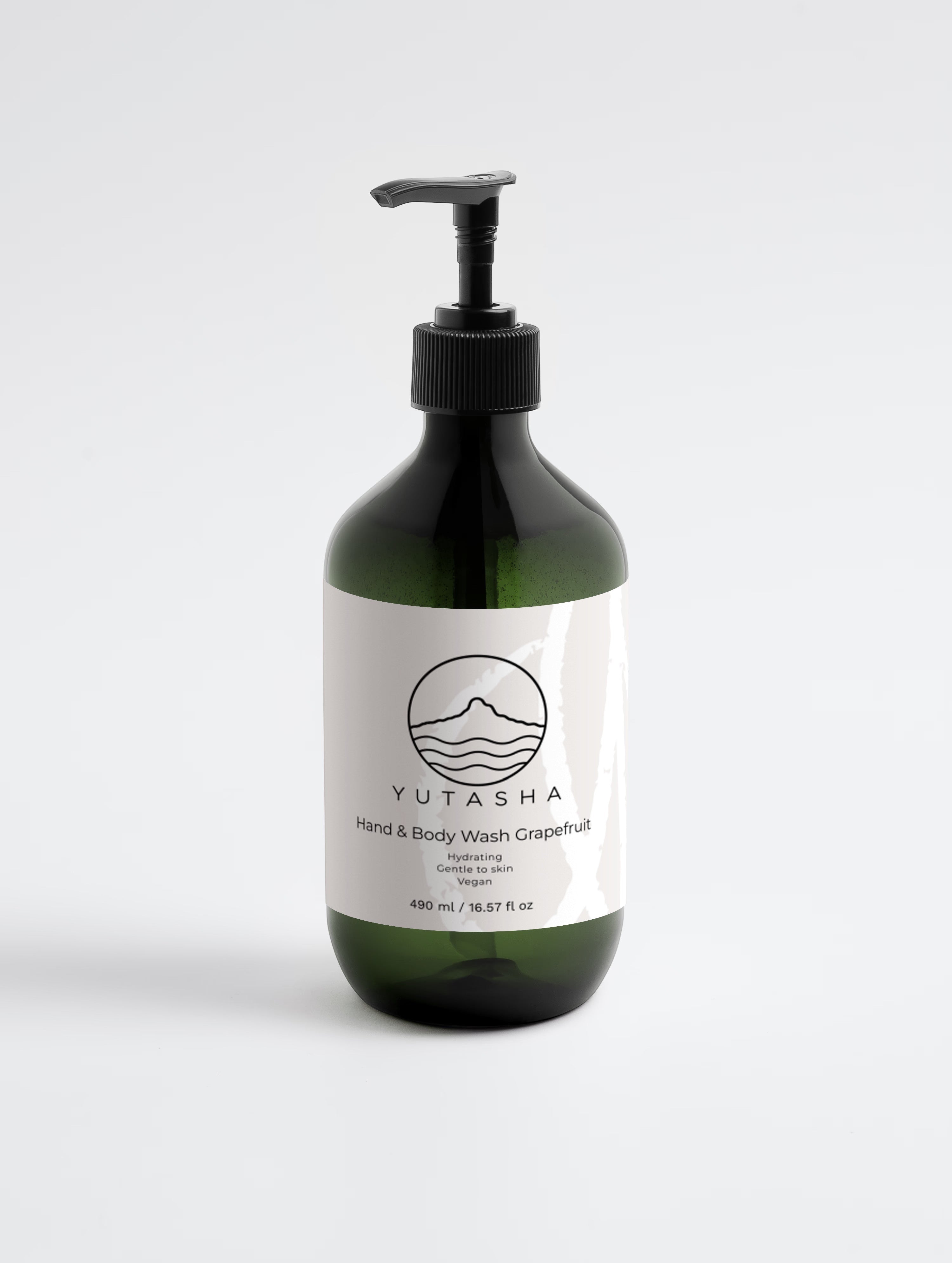 YUTASHA Natsu grapefruit hydrating body wash in a dark green bottle with a black pump dispenser on a white background.
