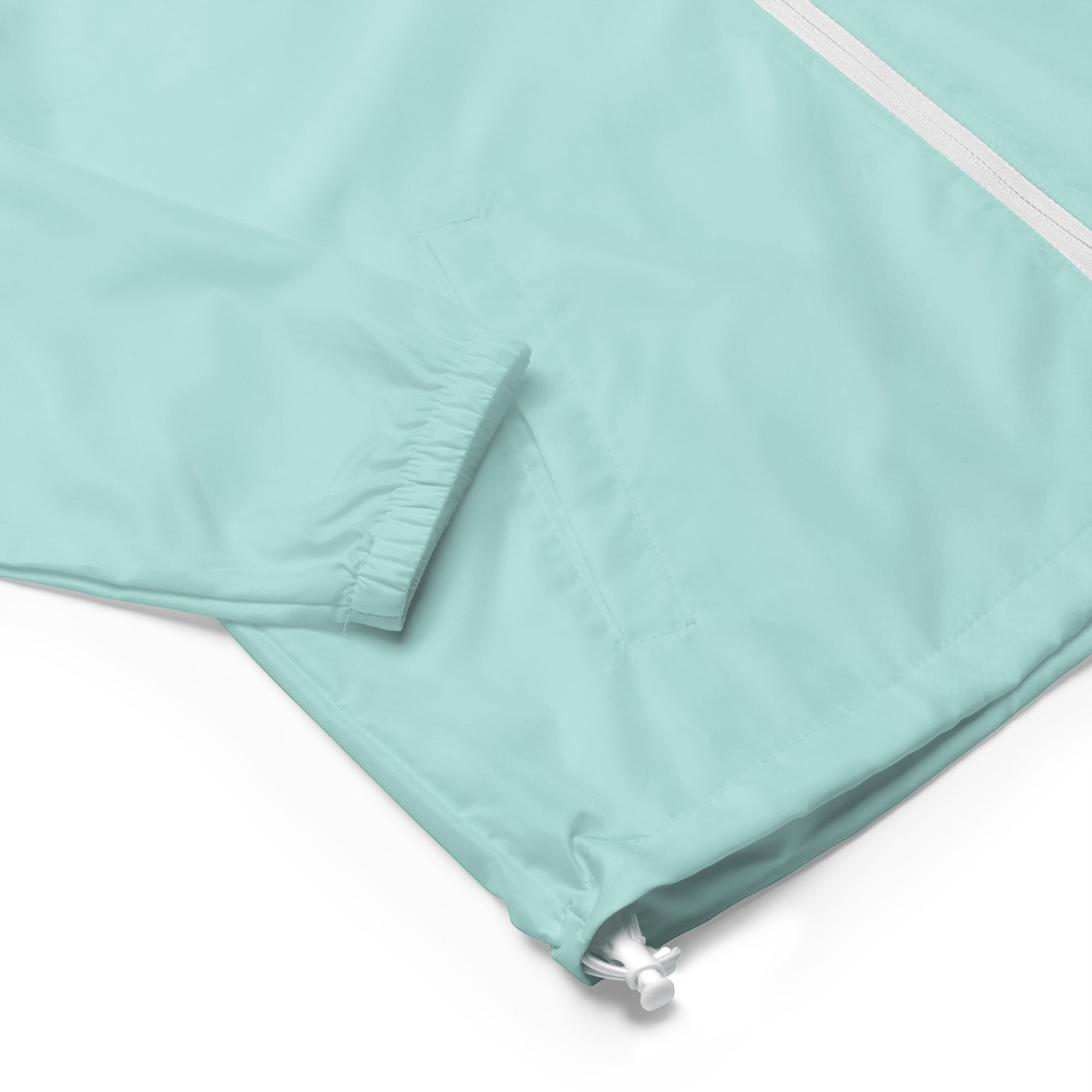 YUTASHA Toshie windbreaker in light mint green polyester with a white zipper, elastic cuffs, and toggle waistband.